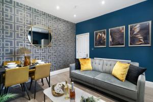 a living room with a couch and a table at Platinum Grove B Modern Flat, 2 Beds with Free Parking in Kent