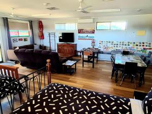 a living room with a couch and a table at The Corner Store B&B entire property in Stawell