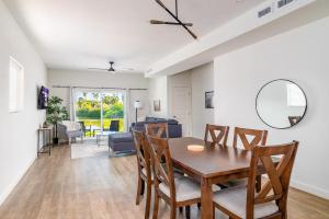 a dining room and living room with a table and chairs at Waterfront Oasis with Bunk Room by SpaceX and SPI in Brownsville