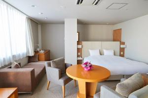 Postel nebo postele na pokoji v ubytování Hotel Crystal Palace