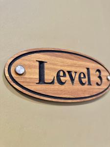 a sign with the word level on a ceiling at Chariton Hotel Nusa Bestari in Johor Bahru