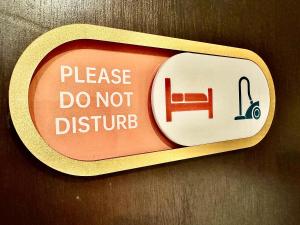 a sign that says please do not disturb at Chariton Hotel Nusa Bestari in Johor Bahru