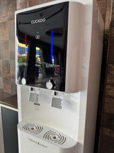 a cuvco coffee machine in a kitchen at Chariton Hotel Nusa Bestari in Johor Bahru