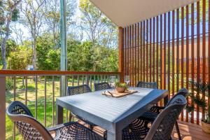 a blue table and chairs on a screened in porch at BIG4 Tasman Holiday Parks - Nambucca Heads in Nambucca Heads