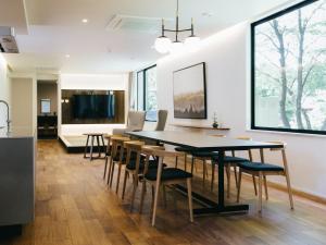 a dining room and kitchen with a table and chairs at TEF TANIGUMI - Vacation STAY 78822v 