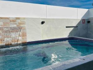 a large swimming pool with water in it at Points in Guayama