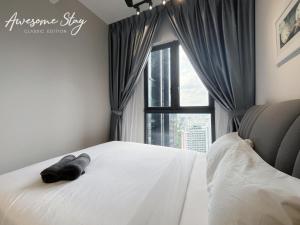 Cama o camas de una habitación en Sunway Velocity Two By Awesomestay