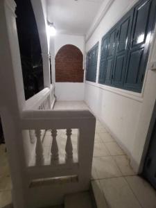 an empty hallway with a bench in a building at Fortunate angle guesthouse 乐居 in Luang Prabang
