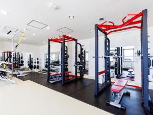 a gym with treadmills and weights at TabistKitami Athlete Stays in Kitami