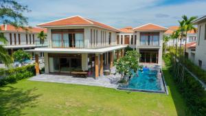an aerial view of a house with a swimming pool at Vacation Home Ocean Villas in Da Nang