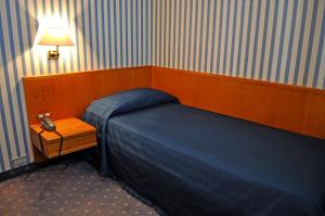Postel nebo postele na pokoji v ubytování Hotel Garda