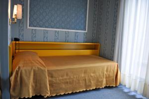 Postel nebo postele na pokoji v ubytování Hotel Garda