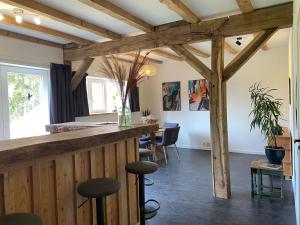 a bar in a room with wooden beams at Spacious holiday home in the Teutoburg Forest in Schieder-Schwalenberg