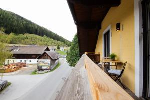 a view from a balcony of a house with a road at Appartement Riedingtal in Zederhaus