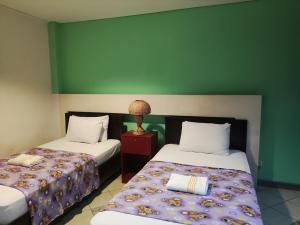 Balai Subik Hotel客房内的一张或多张床位