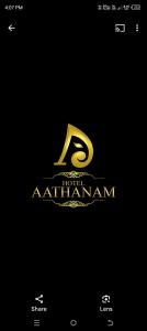 a gold logo with a letter r on a black background at Aathanam in Kanyakumari