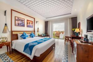 Voodi või voodid majutusasutuse Amina Lantana Hoi An Hotel & Spa toas
