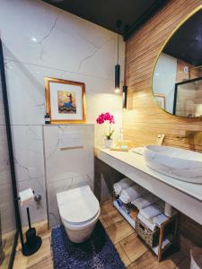 a bathroom with a toilet and a sink at Residence ǁ Corino in Biograd na Moru