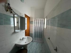 a bathroom with a sink and a mirror at Casa ALCA in Acquavella