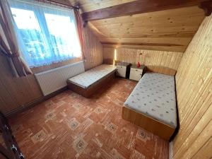 an overhead view of a small cabin with a bed and a window at POKOJE GOŚCINNE U ANIELI in Szczyrk