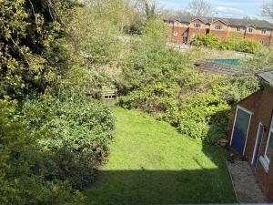 an overhead view of a yard with grass and trees at Beautifully Lit Airy 1-Bed Apartment in Liverpool in Liverpool