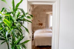 Postel nebo postele na pokoji v ubytování Innesto Rooms - Monopoli + 32 fotografií