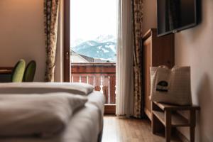 Postel nebo postele na pokoji v ubytování Hotel Goldene Rose