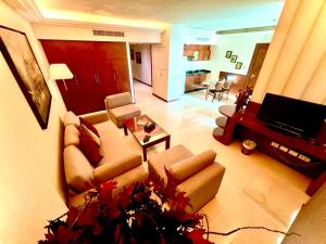 a living room with a couch and a table at King Suites Hotel in Beirut