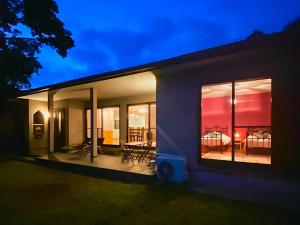 a house with a view of a patio at night at Nonoya - Vacation STAY 78469v in Goto