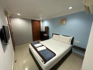 Postel nebo postele na pokoji v ubytování Maha Hotel
