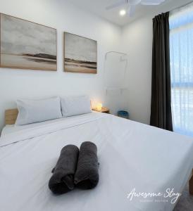 Neu Suites By Awesomestay客房内的一张或多张床位