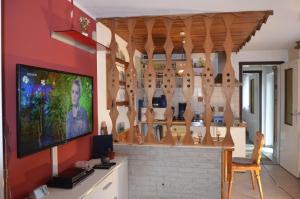a room with wooden spoons hanging on a wall at Ferieneinrichtungen-Haus-am-Stein in Königstein an der Elbe