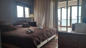 Ein Bett oder Betten in einem Zimmer der Unterkunft Villa Puerto Blanco