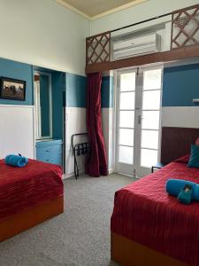 Postel nebo postele na pokoji v ubytování North Gregory Hotel