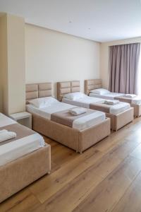 Postel nebo postele na pokoji v ubytování Te Aldo Hotel