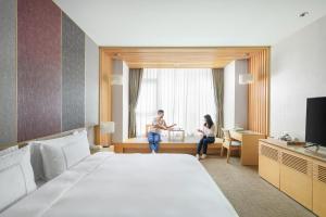 Et tv og/eller underholdning på Evergreen Resort Hotel - Jiaosi
