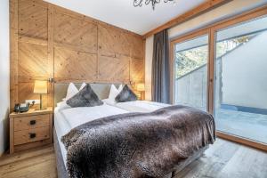 Łóżko lub łóżka w pokoju w obiekcie Gletscherblick- serviced apartments
