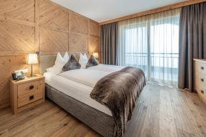 Łóżko lub łóżka w pokoju w obiekcie Gletscherblick- serviced apartments