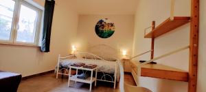 Postel nebo postele na pokoji v ubytování Ai Laghi Bed&Bed