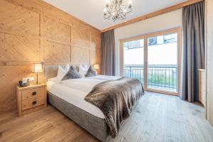 Łóżko lub łóżka w pokoju w obiekcie Gletscherblick- serviced apartments