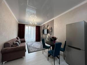 Posezení v ubytování С видом на горы апартаменты с дизайнерским ремонтом