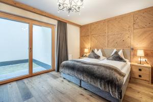 Łóżko lub łóżka w pokoju w obiekcie Gletscherblick- serviced apartments