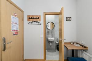 a bathroom with a toilet and a sink at Stay Express Hotel in Vilnius