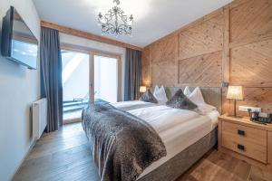 Łóżko lub łóżka w pokoju w obiekcie Gletscherblick- serviced apartments