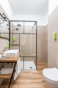a bathroom with a sink and a toilet at Brijuni Hotel Neptun in Fažana