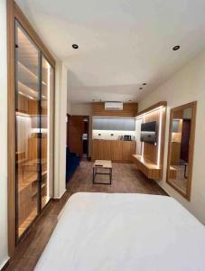 a bedroom with a large bed and a living room at Elite Boutique Hotel in Cairo
