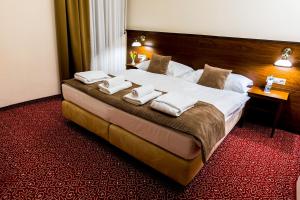 Postel nebo postele na pokoji v ubytování Hotel Bankov Košice