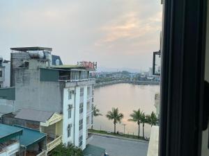a view of a river from a building at Blue Rose Hotel in Ha Long