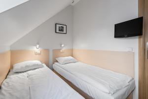 Postel nebo postele na pokoji v ubytování Stay Express