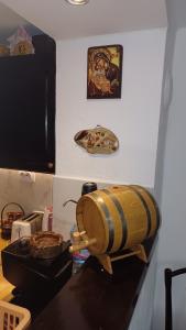 a kitchen counter with a bowl on top of a stove at Къща за гости -Абаджиевата къща in Kotel